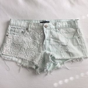 Light teal shorts with lace pocket